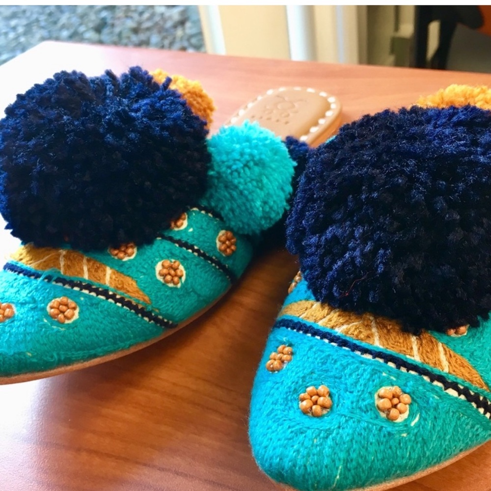 Figue- Turquoise leather Iris slides with pom-poms and beading.